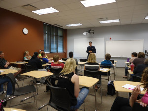 Conductor Ryan Haskins speaking to Music in Western Culture students at the College Center